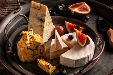 assorted cheese for wine and fruits still life, Food recipe background.