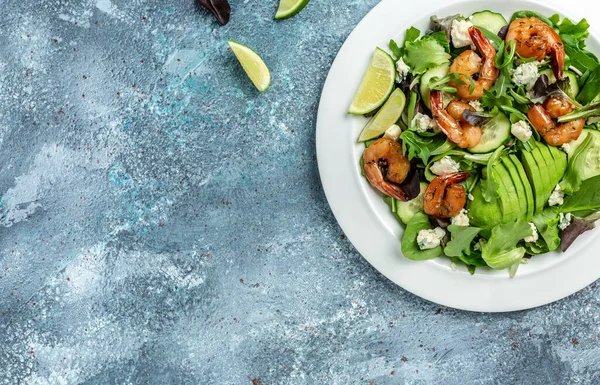 Vegan vegetarian dinner background. Seafood salad with avocado, blue cheese and smoked shrimps. Healthy eating concept. Detox diet. Vegetarian lunch. Weight loss,