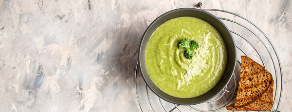 Cream of Green Vegetable Soup. Clean eating, dieting, vegan, vegetarian, healthy food concept, top view.