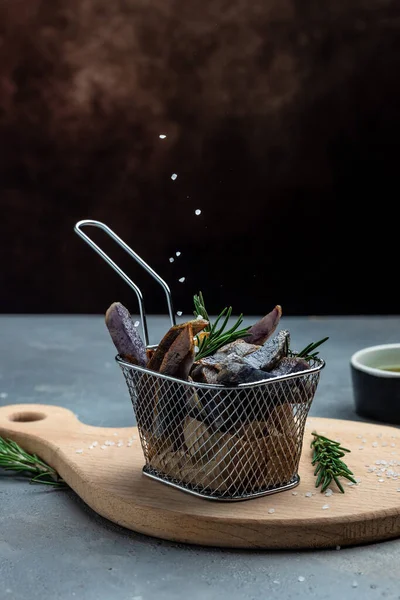 stock image Sweet purple Potato Fries on dark background. Food recipe background. Close up. vegan food concept. vertical image. place for text,