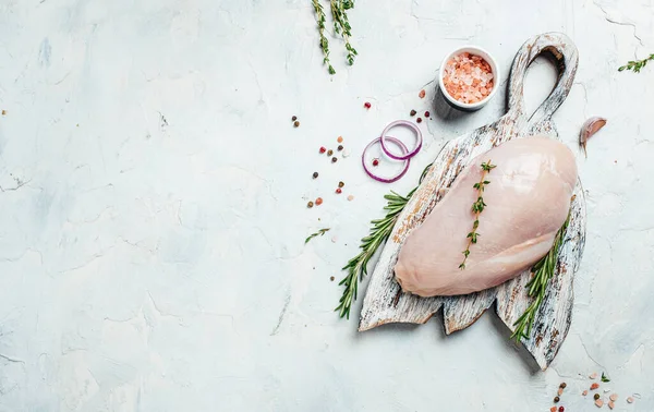 Raw turkey fillet on cutting board, Cooking ingredients. Natural healthy food concept. Long banner format. top view,