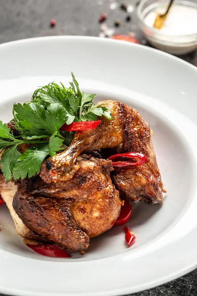 Grilled BBQ crispy chicken legs quarter with tamarind sauce and with chili peppers and herbs, Healthy fats, clean eating for weight loss.
