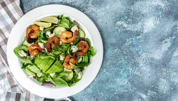 Vegan vegetarian dinner background. Seafood salad with avocado, blue cheese and smoked shrimps. Healthy eating concept. Detox diet. Vegetarian lunch. Weight loss,