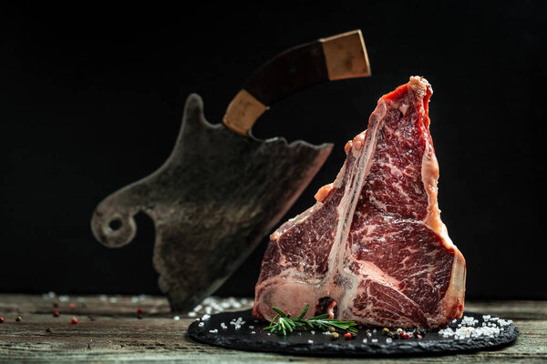 The T-bone or porterhouse steak of beef cut from the short loin. steak include T-shaped bone with meat on each side. Porterhouse steaks are cut from the rear end of the short loin.