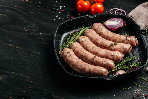 stock image Raw stuffed sausages in cookware. Sausages for grilling. Long banner format. top view.