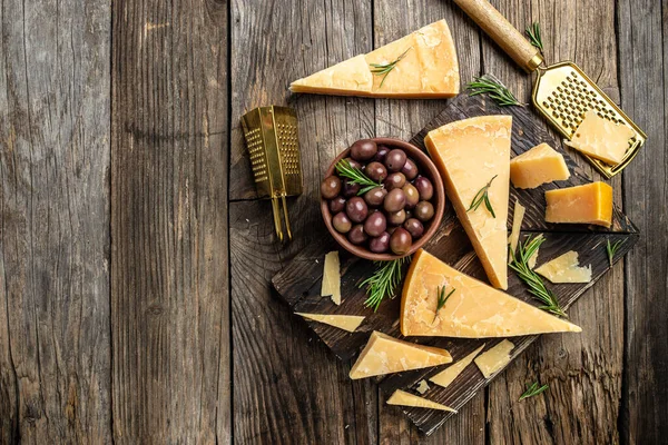 Parmesan Cheese Wooden Board Hard Cheese Olives Rosemary Metal Grater — Stock Photo, Image