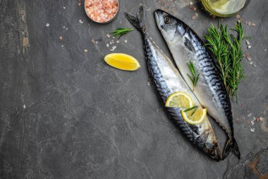 marinated mackerel or herring fish with salt, lemon and spices on a metal tray. Seafood concept. Long banner format. top view.