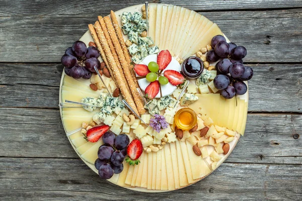 Antipasto platter, Antipasto Cheese board of various types of soft and hard cheese. spanish manchego cheese, aperitivo party concept, banner, menu, recipe place for text,