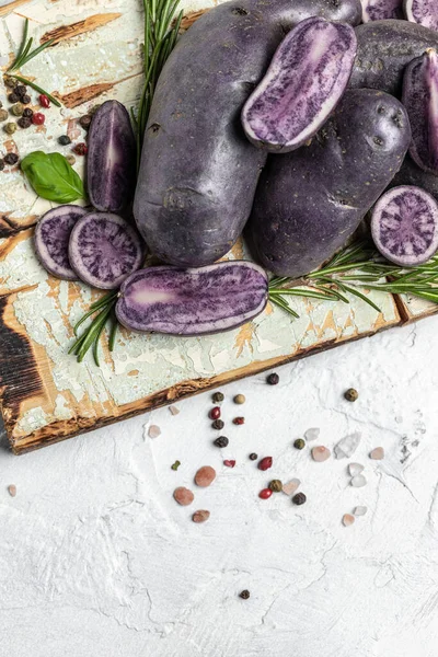 Raw cut purple sweet potatoes isolated on white background. Ipomoea batatas. Batata potato. vertical image. top view.