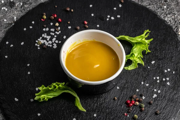 Fresh homemade organic mustard and honey sauce on a dark background, Food recipe background. Close up,