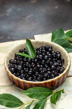 Maqui berries Superfoods antioxidant of indian mapuche. vertical image. top view. place for text.