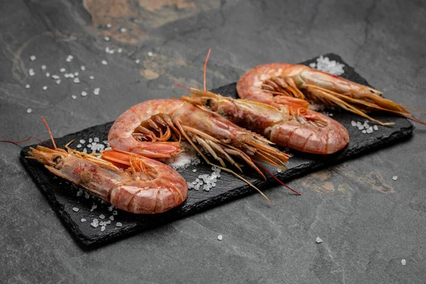 Shrimps, prawns. Seafood Red Argentine shrimps with ice, Wild shrimps, ocean jumbo shrimps. banner, menu, recipe place for text, top view,