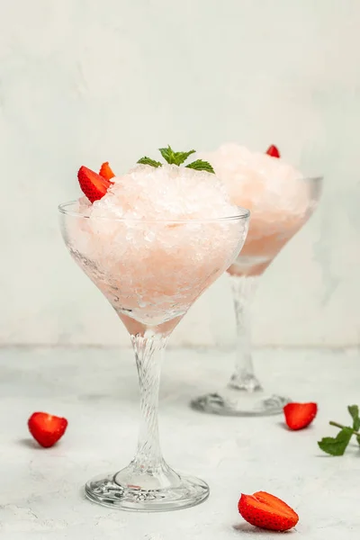 Frose cocktail mixed with strawberriess with pink wine. Alcoholic Beverage. Boozy Frozen Rose Frose.