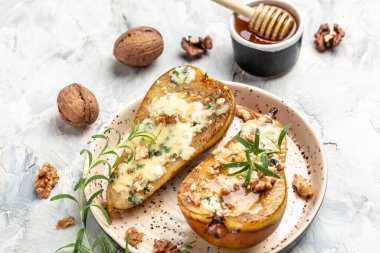 Pears baked with blue cheese, nuts, honey. French cuisine. Vegetarian lunch. banner, menu, recipe place for text, top view.