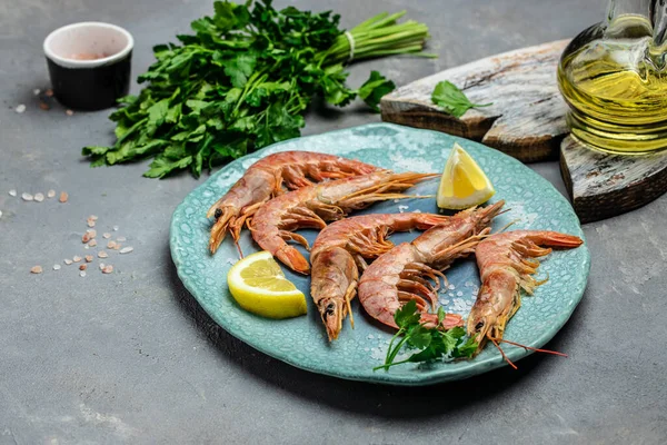 Red Argentine shrimps with lemon, Wild shrimps, ocean jumbo shrimps. Restaurant menu, dieting, cookbook recipe top view.