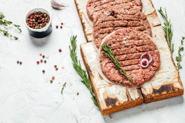 hamburger patties, minced meat for burger, beef lamb meat Burger steak on a wooden board, top view. place for text.