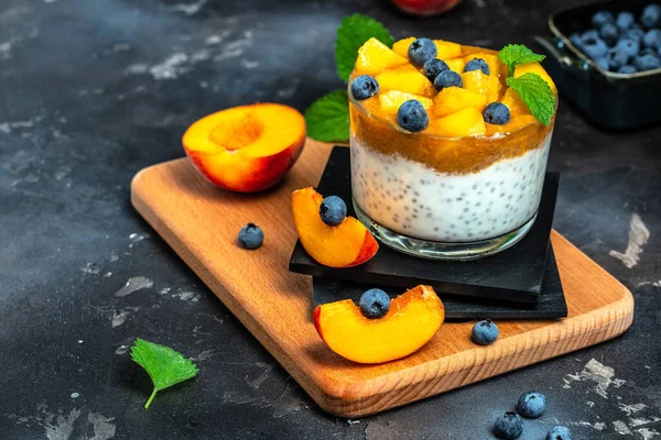 yogurt with peaches and chia. Healthy eating. Breakfast, snack, Restaurant menu, dieting, cookbook recipe top view.