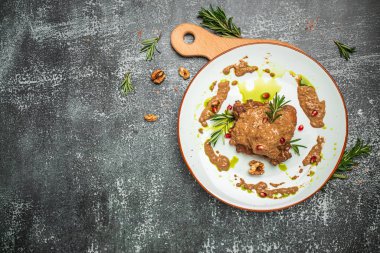 pork medallions with walnut sauce. Georgian cuisine. Ketogenic diet food. banner, menu, recipe place for text, top view.