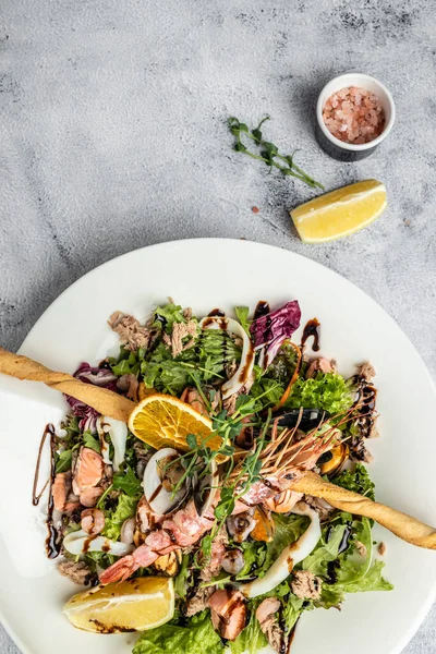 Healthy salad plate seafood eggs and shrimp. Restaurant menu, dieting, cookbook recipe vertical image. place for text.