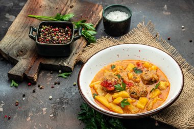 stew vegetables with meatballs on a dark background, Delicious balanced food concept, place for text, top view,