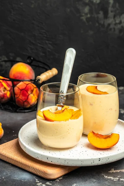 yogurt peaches breakfast drink, fresh blended peach smoothie, vertical image place for text,