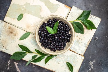 Bilberry. Fresh Wild berries,. Superfoods antioxidant. Bowl of fresh berry on dark background, Long banner format. top view.