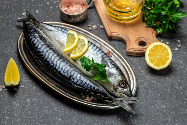 marinated mackerel or herring fish with salt, lemon and spices. Seafood concept. top view.