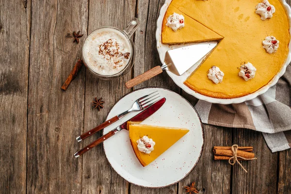 Traditional pumpkin tart cake sweet dessert, Homemade pastry for Thanksgiving. Pumpkin cheesecake, top view.