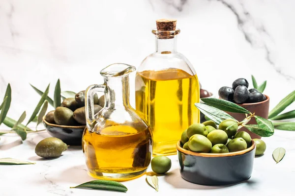 Olive Oil Two Glass Containers Harvest Olives Berries Bowls Light — Stock Photo, Image