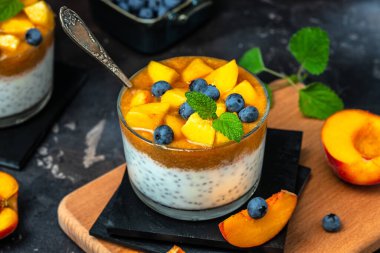 peaches blueberry chia yogurt. Homemade dessert with fruits. place for text, top view.