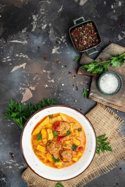 stew vegetables with meatballs on a dark background, Delicious balanced food concept, place for text, top view,