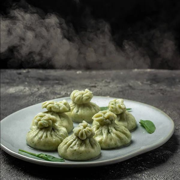 Hot Khinkali with cheese on a dark background. banner, menu, recipe place for text, top view.