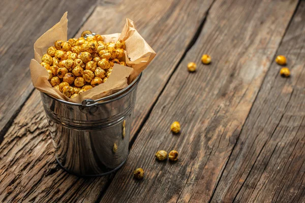 Spicy crispy roasted chickpeas. Traditional Indian cuisine. Tasty vegetarian and vegan chickpea snack. banner, menu, recipe place for text, top view.