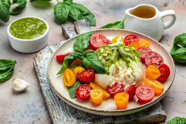 Salad with burrata cheese, cherry tomatoes