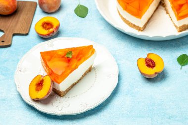 dessert peaches, cheesecake with peache jelly on white plate. Restaurant menu, dieting, cookbook recipe top view.