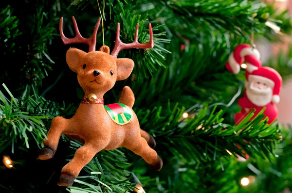 Reindeer with Santa claus on a Christmas tree — Stock Photo, Image