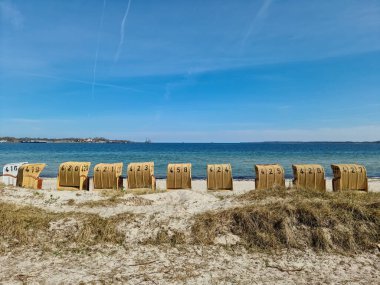 Beach chairs on a sunny summer day on the beach at the Baltic Sea