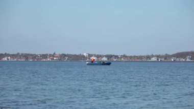 Two men fishing from a boat on the Baltic Sea off Eckernfoerde.