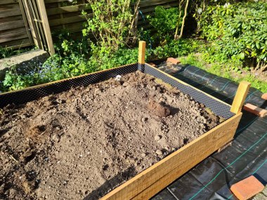 Raised herbal bed during construction in a german garden
