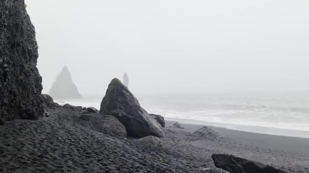 The famous endless black beach on Iceland in strong winds with powerful surf.