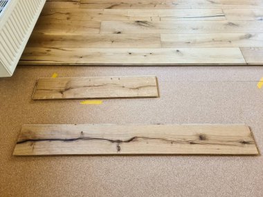 A parquet floor made of wood while it is being freshly installed