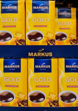 Kiel,Germany - 20 August 2022: Numerous packages of Markus brand coffee on a supermarket shelf