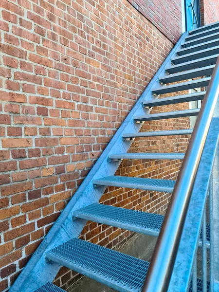 Close View Metallic Stairs Front Brick Wall — 图库照片
