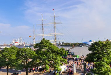 Hamburg, Germany, 27 August 2022, Beautiful view at the port of Hamburg with ships and people on a sunny summer day