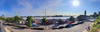 Hamburg, Germany, 27 August 2022, Beautiful view at the port of Hamburg with ships and people on a sunny summer day