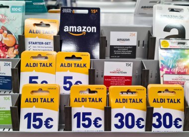Kiel, Germany - 03. September 2022: A lot of credit and gift cards from Playstation, Xbox, Vodafone, Alditalk and Amazon in a supermarket