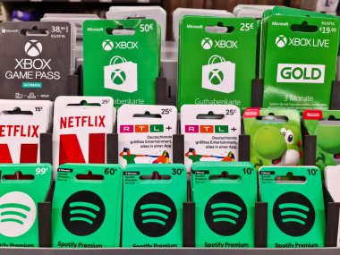 Kiel, Germany - 03. September 2022: A lot of credit and gift cards from Playstation, Xbox, Vodafone, Alditalk and Amazon in a supermarket