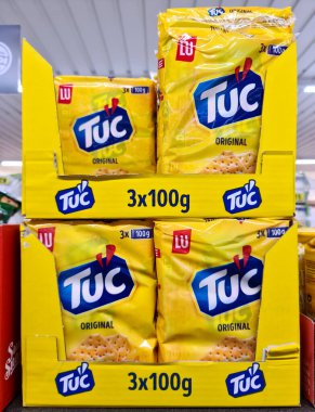 Kiel, Germany - 03 September 2022: Numerous packs of TUC brand biscuits on a supermarket shelf