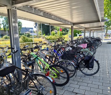 Kiel, Germany - 03. September 2022: Bicycles at a parking space close to a railway station