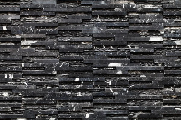 Siyah bir taş duvar — Stok fotoğraf